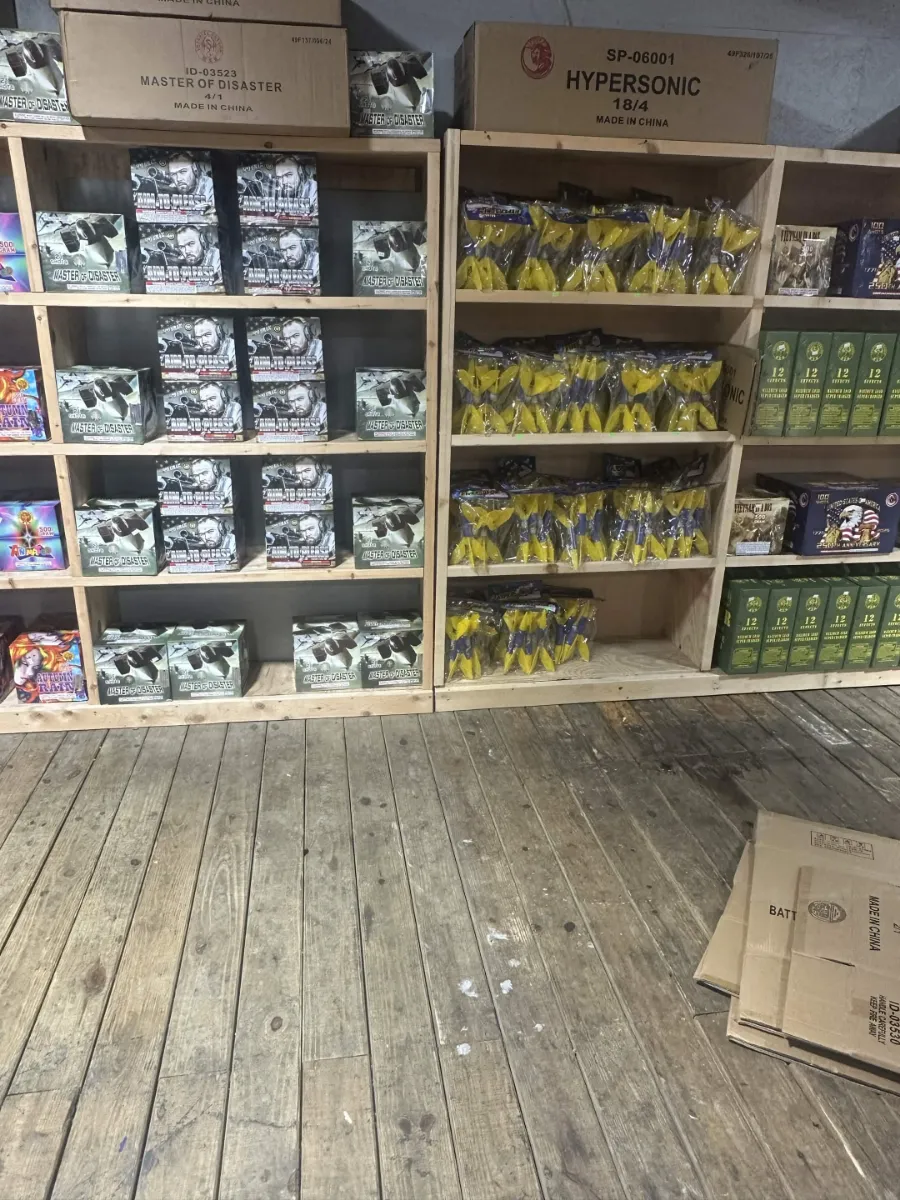 Shelves stocked with cakes and repeaters